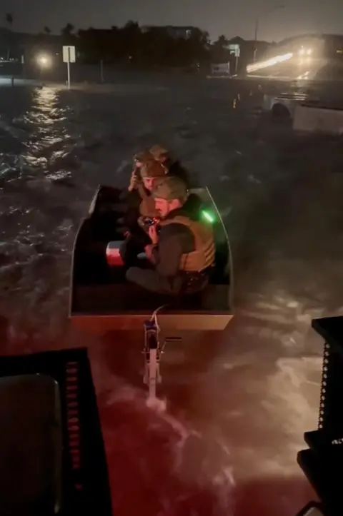 Lee County Sheriff's Office/Handout via REUTERS Marine deputies prepare for a rescue as Hurricane Helene approaches Fort Myers Beach, Florida