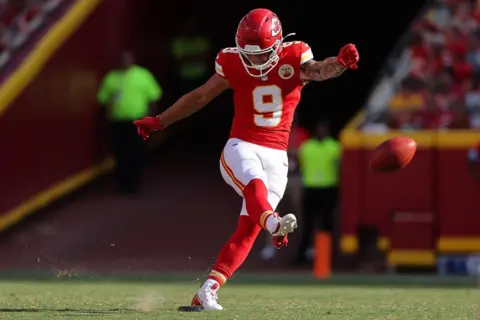 Getty Images Louis Rees-Zammit kicks off during the fourth quarter pre-season game against the Detroit Lions on 17 August