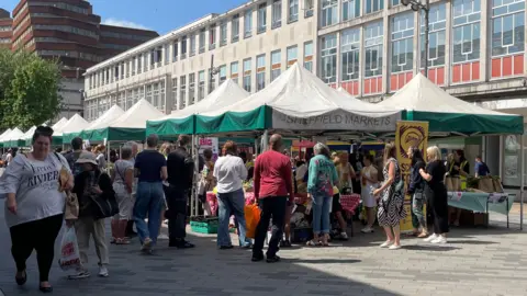Tom MacDougall/BBC A wide-shot of the busy Moor Market.