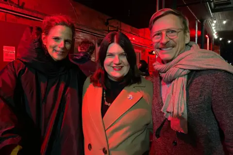 Joe Logan/MEC, studios Mary Ellen with two people under “indestructible language” 