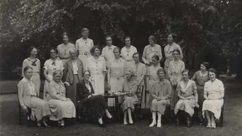 Newnham College the Principal and Fellows in 1936, with Pernel Strachey (front row, 3rd from left), Alda Milner-Barry (middle row, 4th from left), and Dorothy Garrod (back row, 3rd from left)