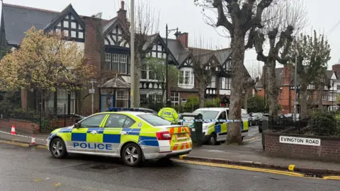 Leicester Media Online St James Road. A police cordon is in place across the road, with a police car blocking the entrance.