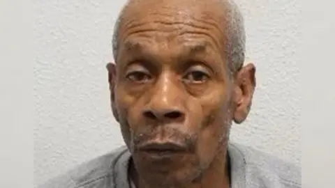 Met Police Carl Cooper, a balding black man in his 60s