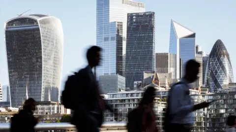 Getty Images City of London skyline with people walking in the foreground