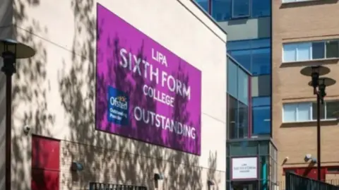 LIPA's main sign, in purple with white lettering