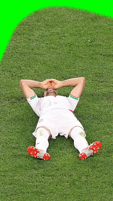 Iranian player on the floor in tears.