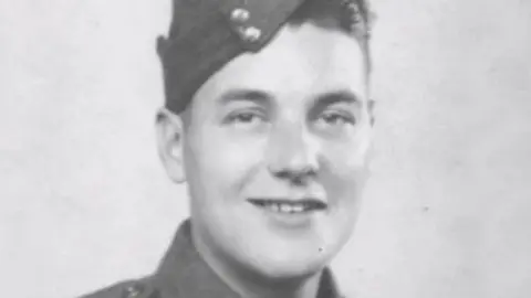 An old black and white photo of Sapper George Onions in uniform.