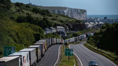 Getty Images Lorries queue along the A20 heading towards the Port of Dover in Dover, UK, on Friday, June 28, 2024. 