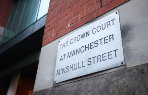 PA Media A sign at the court house reading "The Crown Court at Manchester Minshull Street"