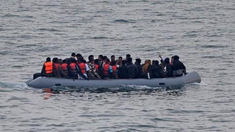 A group of migrants on an inflatable dinghy in the English Channel