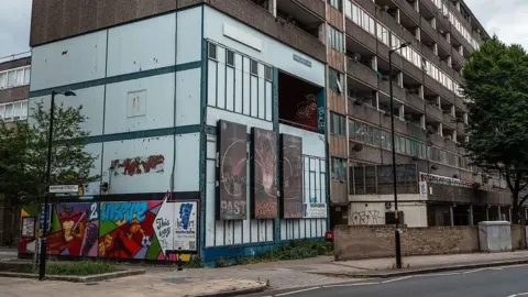 Getty Images A residential tower block stands empty on the Aylesbury Estate in London