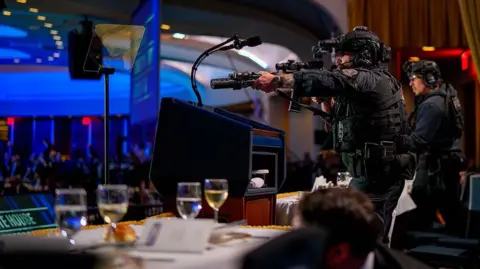 Getty Images Secret Service agent points a large weapon