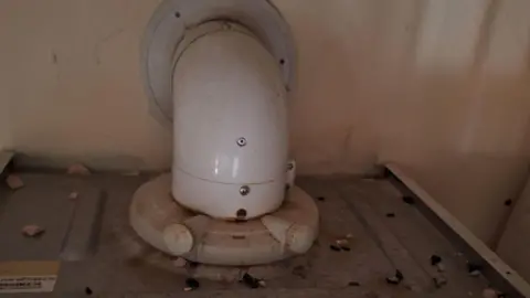 James Grant/BBC  The top of a boiler covered in rat droppings 