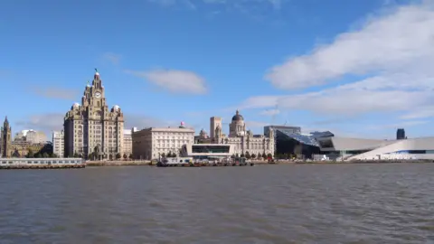 Image taken from River Mersey shows the famous Three Graces, the Liver Building, the Cunard Building and the Port of Liverpool building