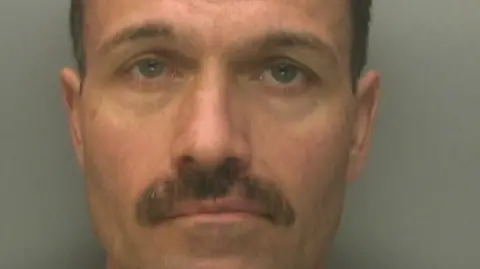 A custody image of Darren Hanson.