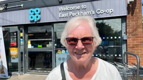 June James stands in front of the Co-Op in East Peckham village centre.
