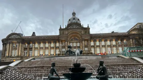 Looking up to Birmingham City Council's building with the floozy in the jacuzzi fountain in the forefront of the photo
