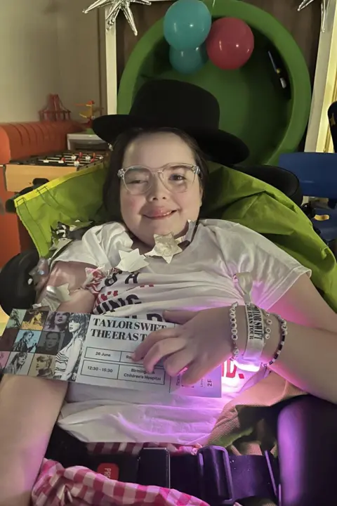 Family Daisie with her ticket and 22 hat