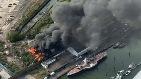 Josh Harwood An aerial shot of a large building fire.