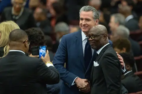 Getty Images Gov Gavin Newsom is seen shaking the hand of a fellow mourner at Jesse Jackson's memorial service 