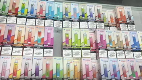Lancashire County Council A stack of coloured vapes in boxes 