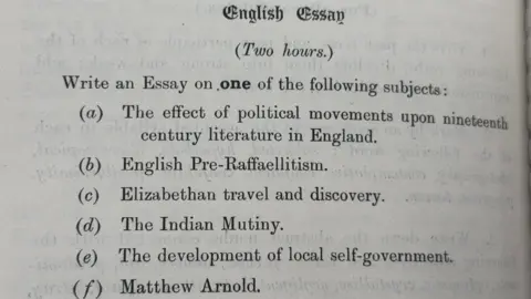 A printed page from the English examination of 1913. Candidates get two hours to write essays on a variety of topics ranging from Elizabethan travel and exploration to Indian rebellion