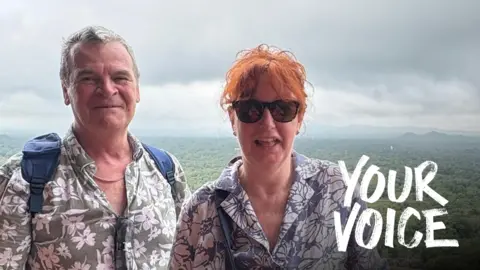 Debbie Rainbird Ardon and Debbie Rainbird on holiday with a forest view behind them.