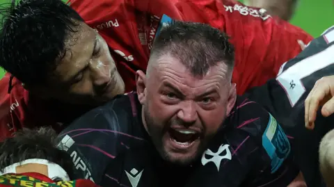 Ospreys hooker Sam Parry, who has played seven internationals for Wales, celebrates scoring a try against Scarlets