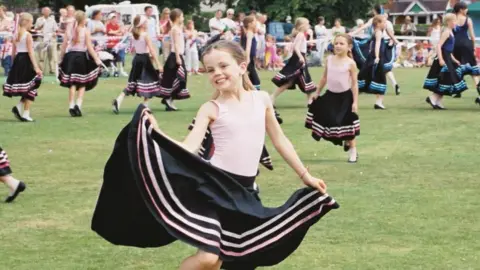 Eva Phillips Archive image of Eva Phillips dancing with a large black skirt on