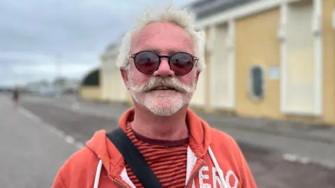 George Cardin/BBC Brighton resident Rob Hill speaking to BBC Radio Sussex