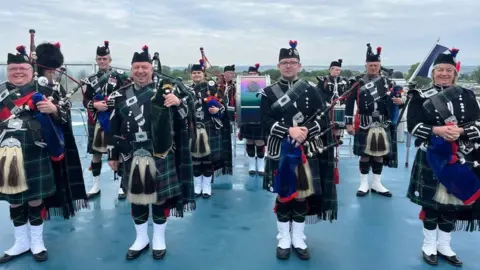 The Jedburgh Pipe Band played on the ferry out of the harbour