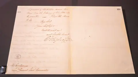 George Washington’s signature on a document to General Charles Cornwallis at Yorktown, 17 October 1781 inside a glass cabinet at Revolution 250: America's Independence Story, 1763-1783 at the National Archives, in Kew, Surrey.