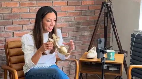 Jenny Bailey Jenny Bailey filming social media content for her business, Calla Shoes