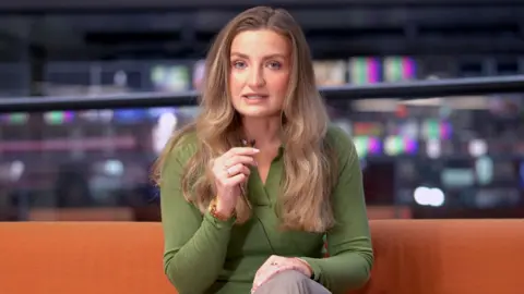 Charlie Buckland, BBC journalist talks to the camera