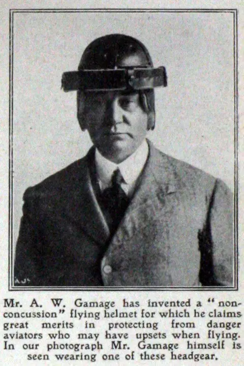 Commons Albert Gamage modelling his "non-concussion" helmet, which looks like a clumsy bowler hat made of metal.