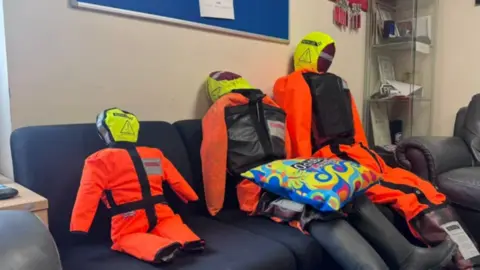 Nottinghamshire Fire Service Three bright orange dummies with yellow heads
