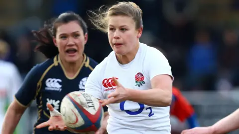 Getty Images Georgina Gulliver playing rugby for England. 