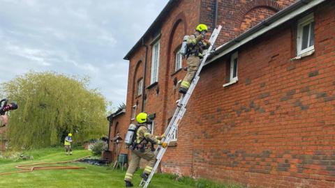 Firefighters dealing with a chimney fire in Rawreth, Essex