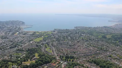 An aerial view of Torquay, Paignton and Brixham which make up the Torbay area