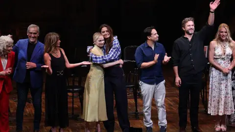 Getty Images Cast of Dawson's Creek - Michelle Williams and Katie Holmes hug in the centre