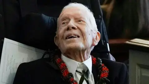 Getty Images Jimmy Carter difoto di pemakaman istrinya Rosalynn pada tahun 2023