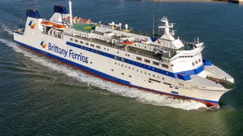 Brittany Ferries A Brittany Ferries vessel under sail on a calm sea.