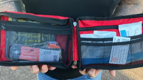 Red pack containing medical kit