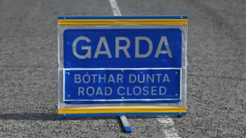 Garda sign in blue and white and yellow.