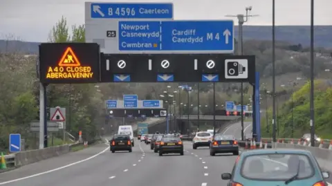 Lewis Clarke A wide shot of the M4 in Newport, showing a large number of cars driving down the three-lane road.