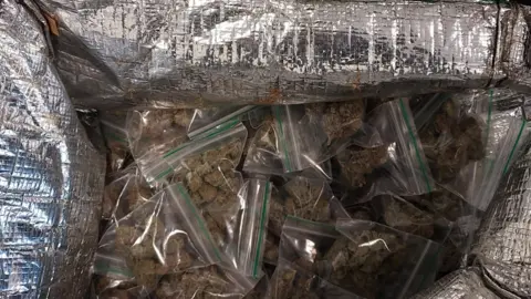 TVP Silver inside of food delivery bag full of small bags of drugs
