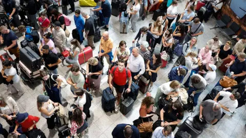 A group of people waiting at EPA Eindhoven Airport