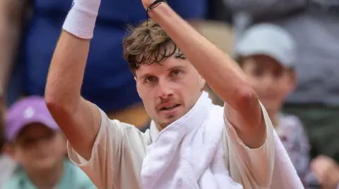 Great Britain's Toby Samuel applauds the crowd after beating David Goffin in French Open qualifying