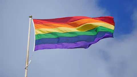 PA Media A rainbow flag