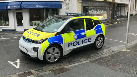 BBC Guernsey Police car parked on a road